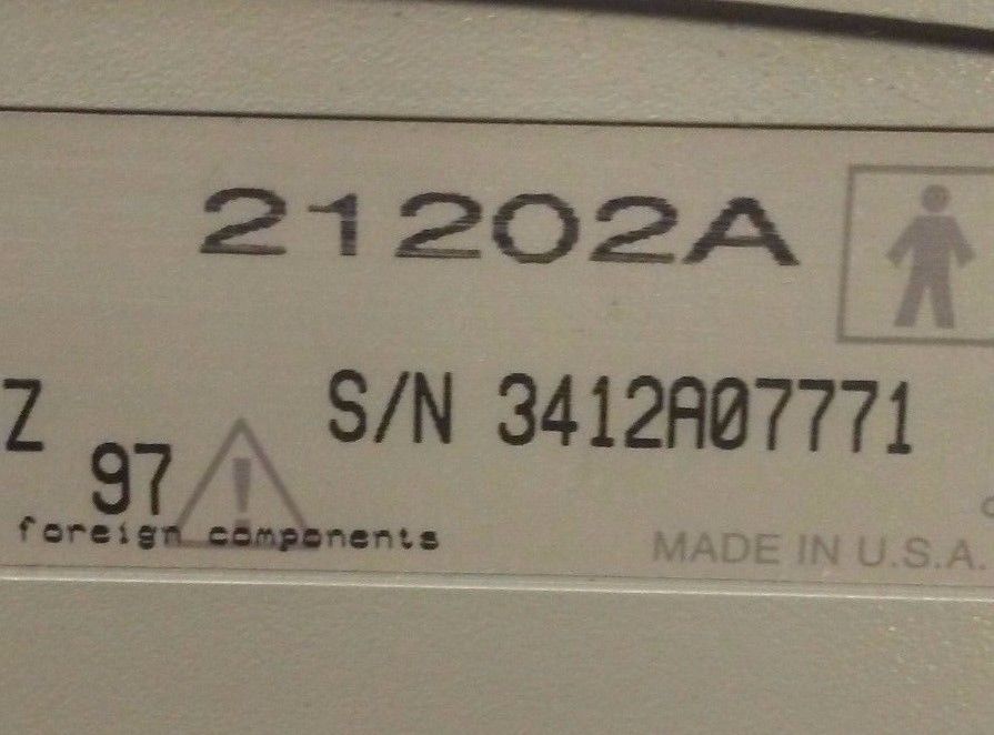 a white sign on a probe connector