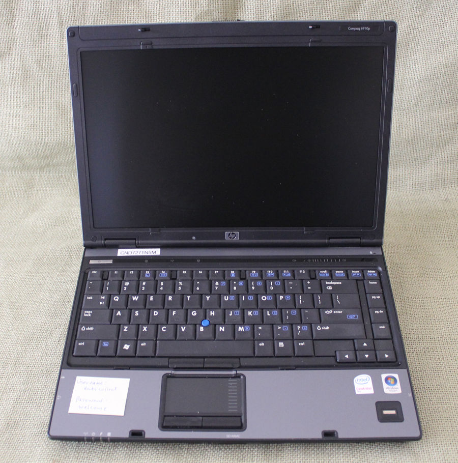 a laptop computer sitting on top of a table
