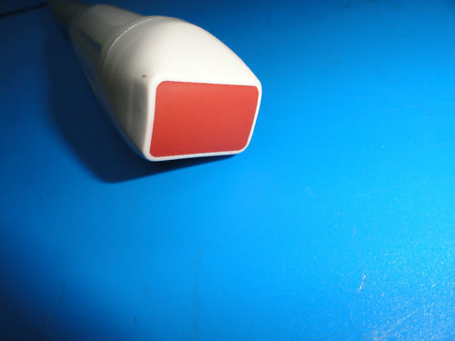 a red and white tube sitting on top of a blue table