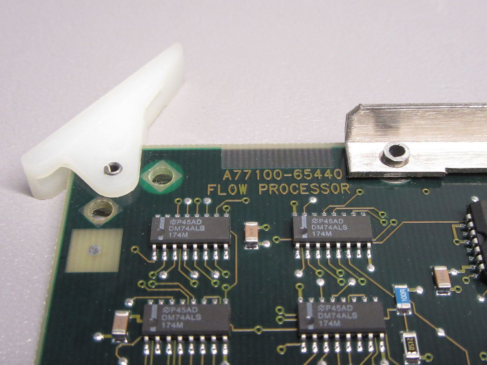 a close up of a circuit board with a device attached to it