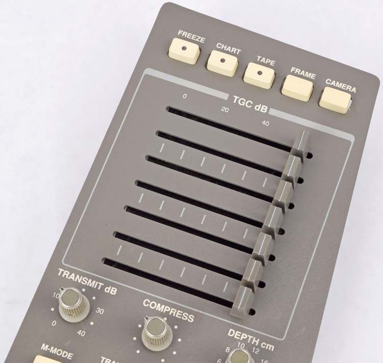 a close up of a sound processor on a white surface