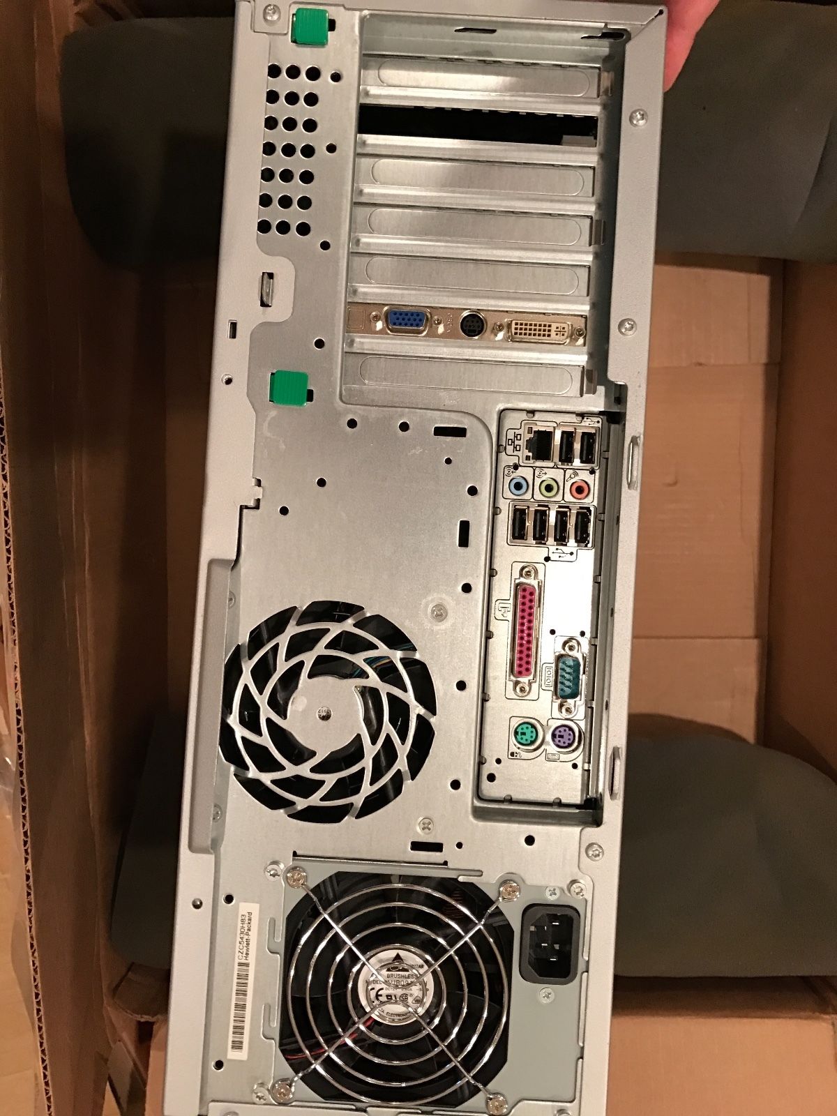 a person holding a computer in a box