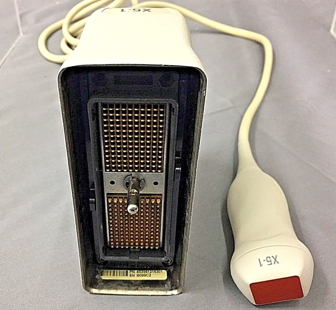 a white electronic device with a cord attached to it