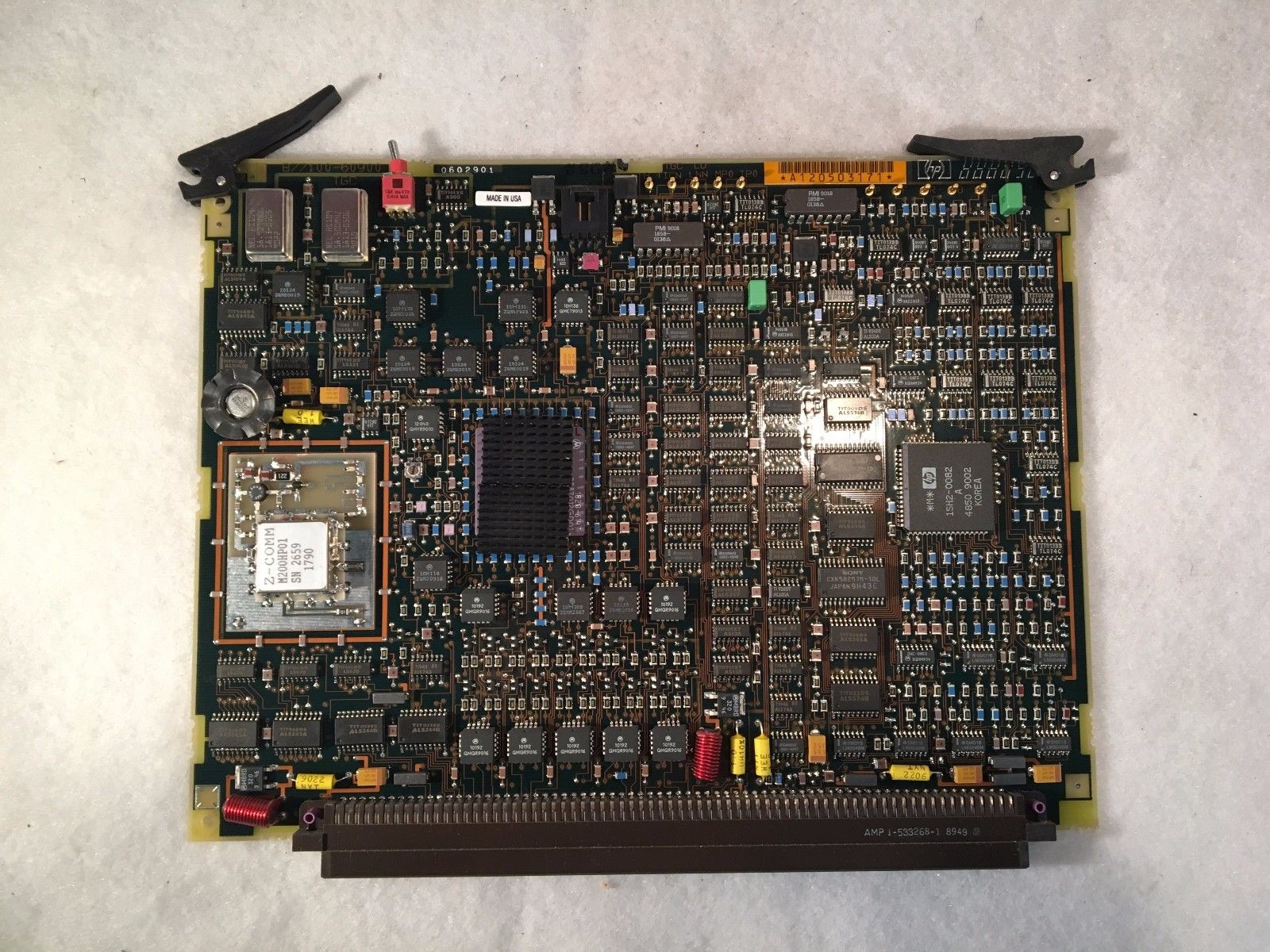 a close up of a computer motherboard on a white surface