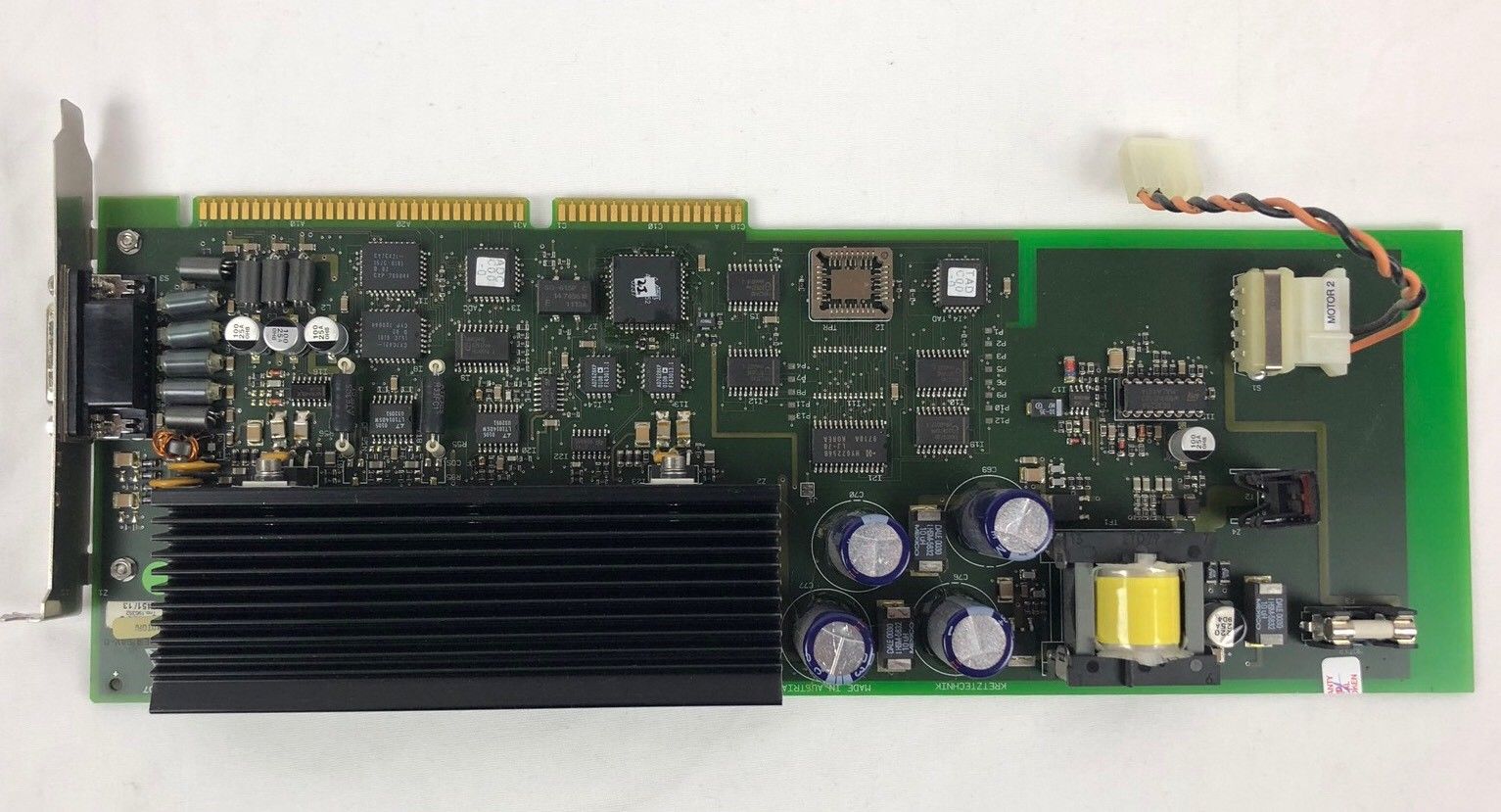 a close up of a computer motherboard on a white surface