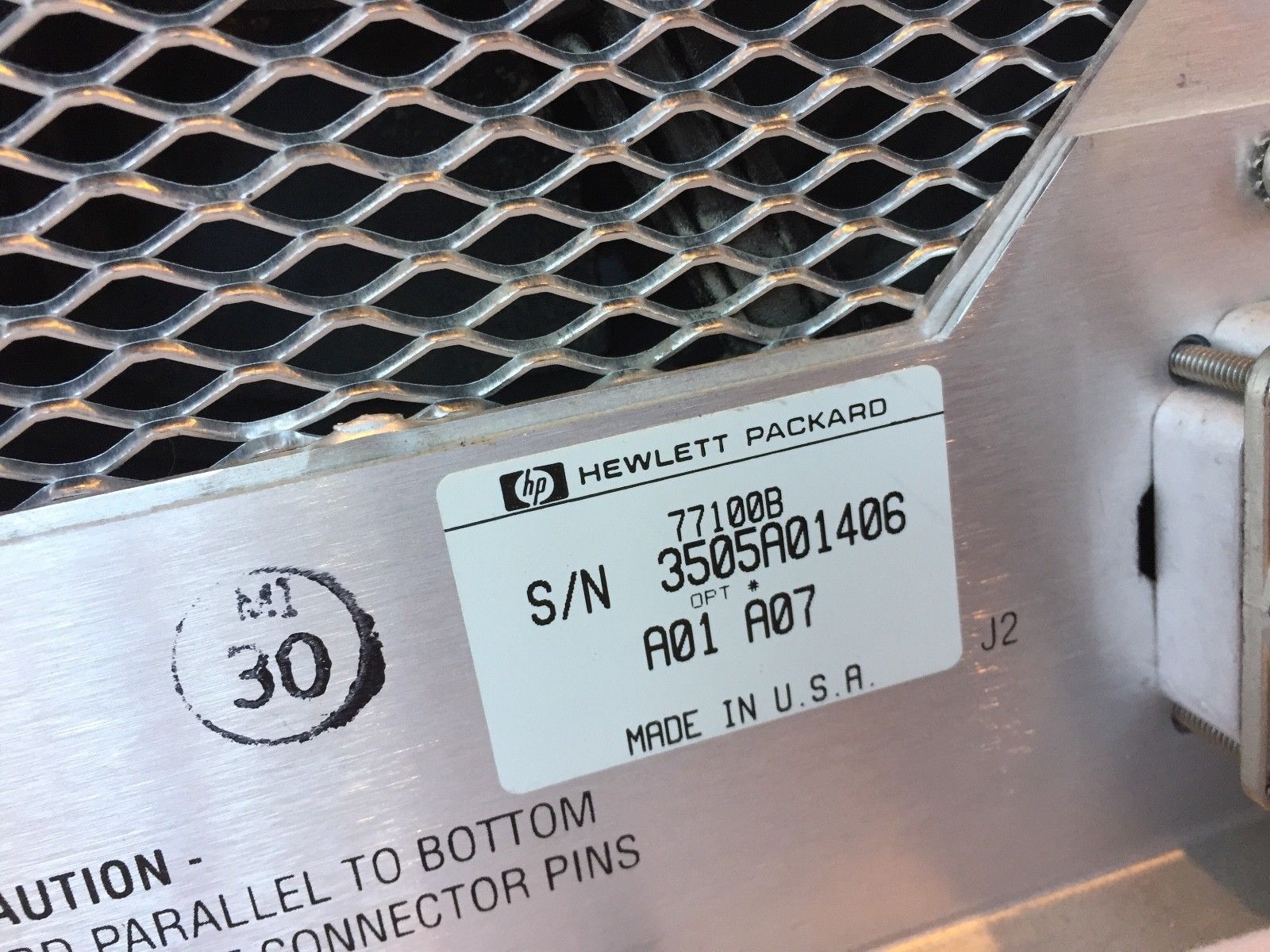 a close up of a metal object with a label on it