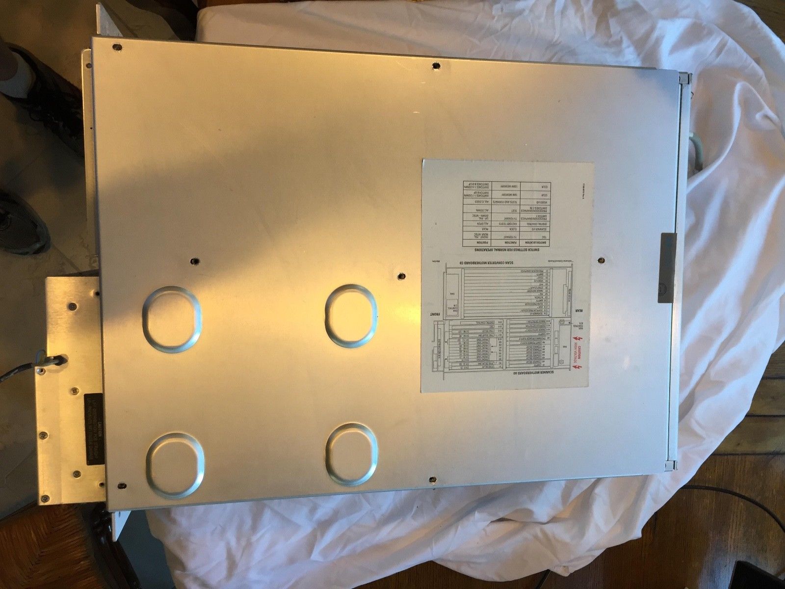 a piece of metal with some holes in it