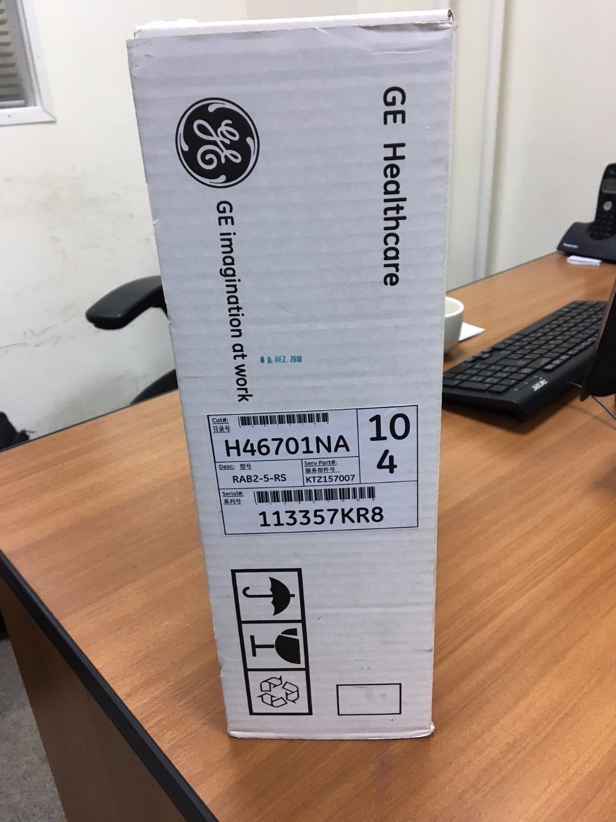 a box sitting on top of a wooden desk