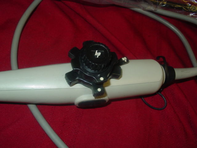 a close up of a hair dryer on a bed