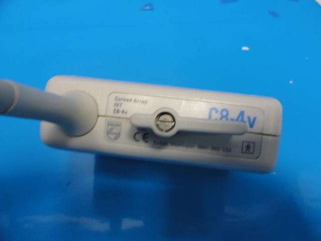 a close up of a probe white electronic device on a blue surface