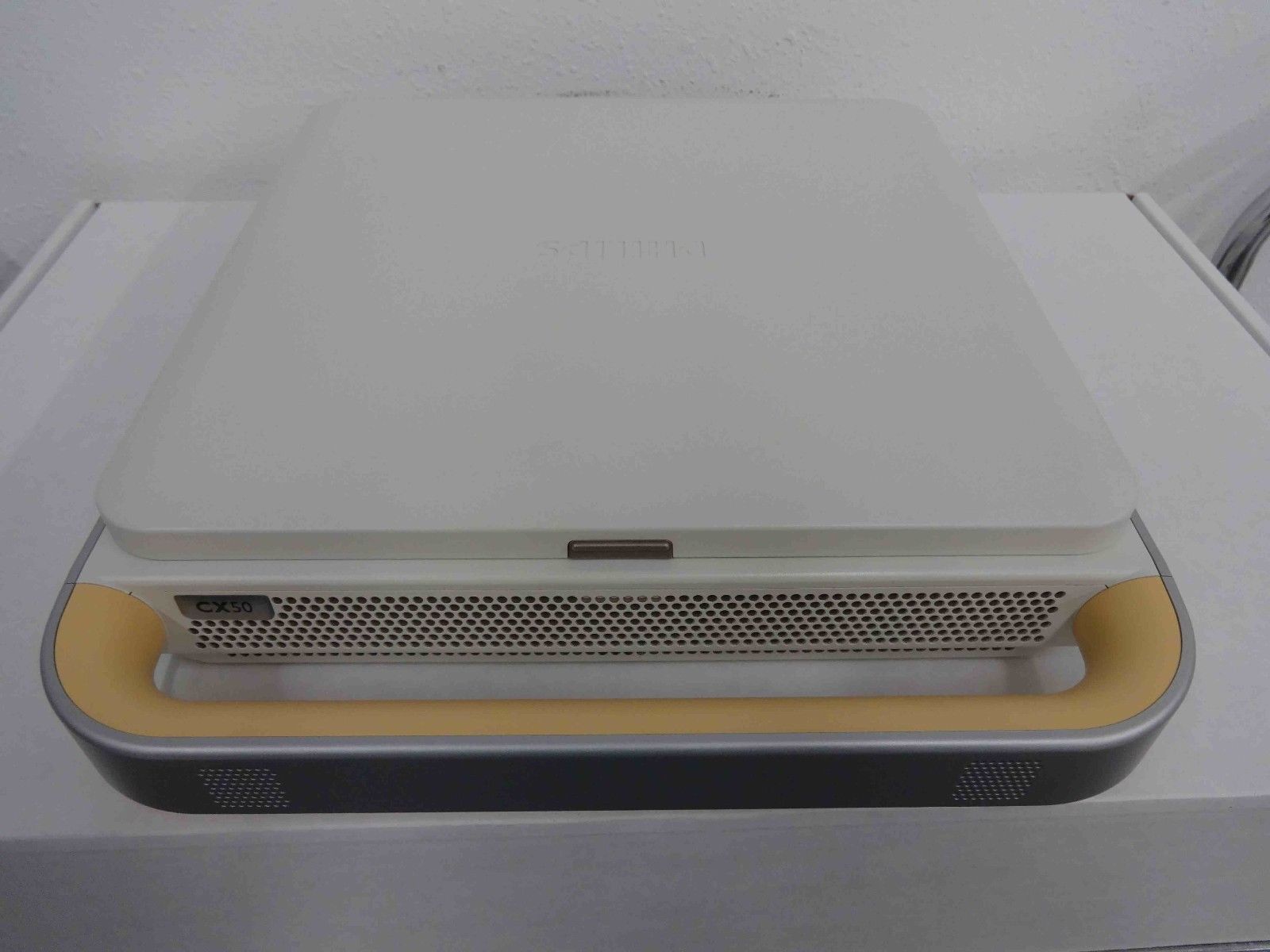 a white laptop sitting on top of a table