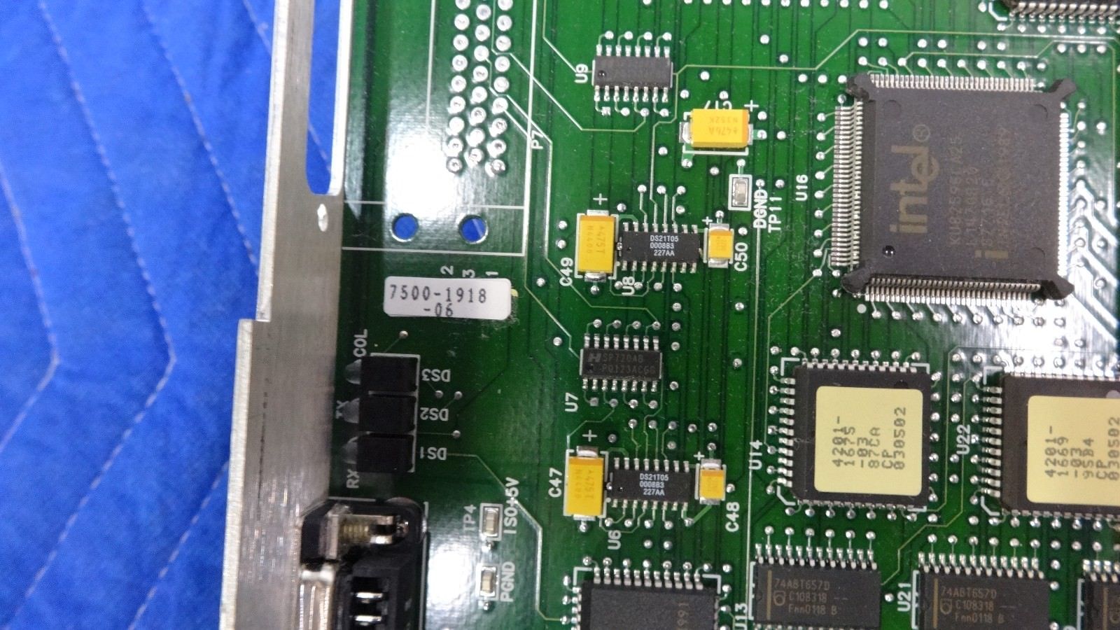 a close up of a computer board with many electronic components