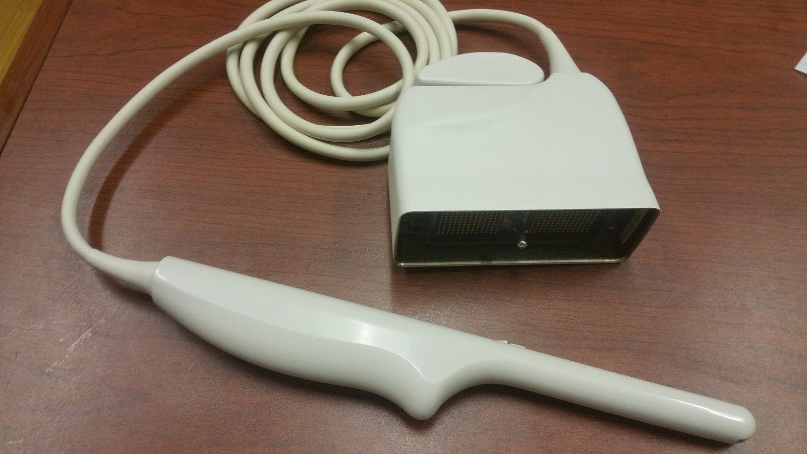 a white object sitting on top of a wooden table