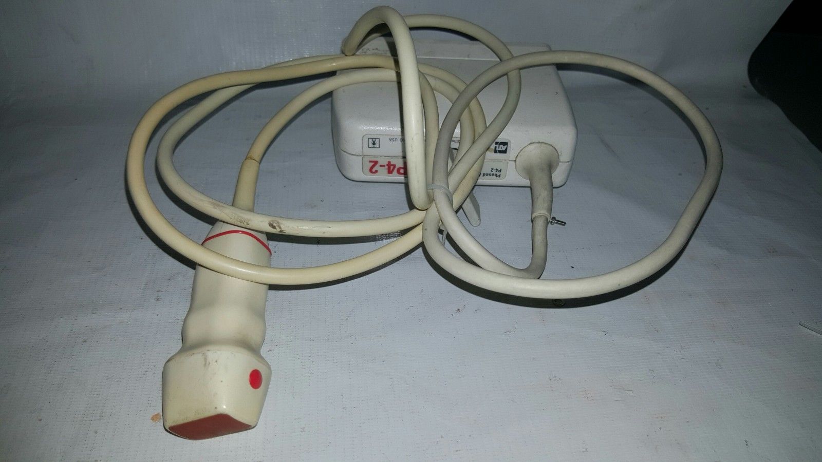a white cord connected to an electrical outlet