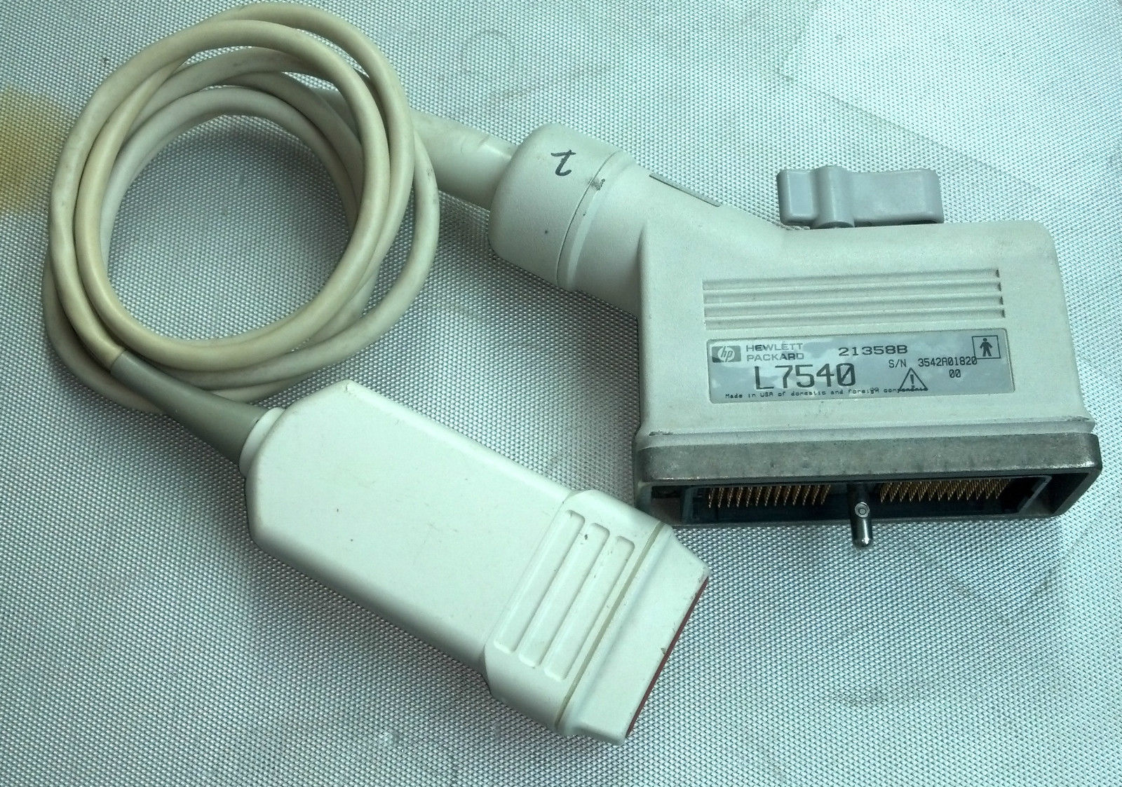 a nintendo wii game controller and a cable