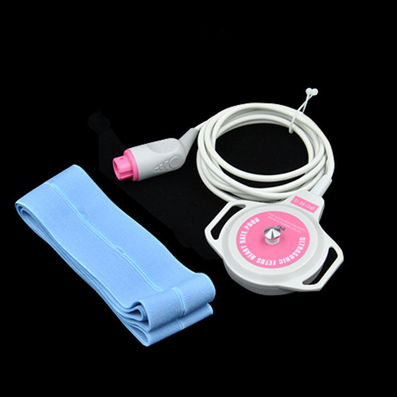 white and pink fetal sensor on black table