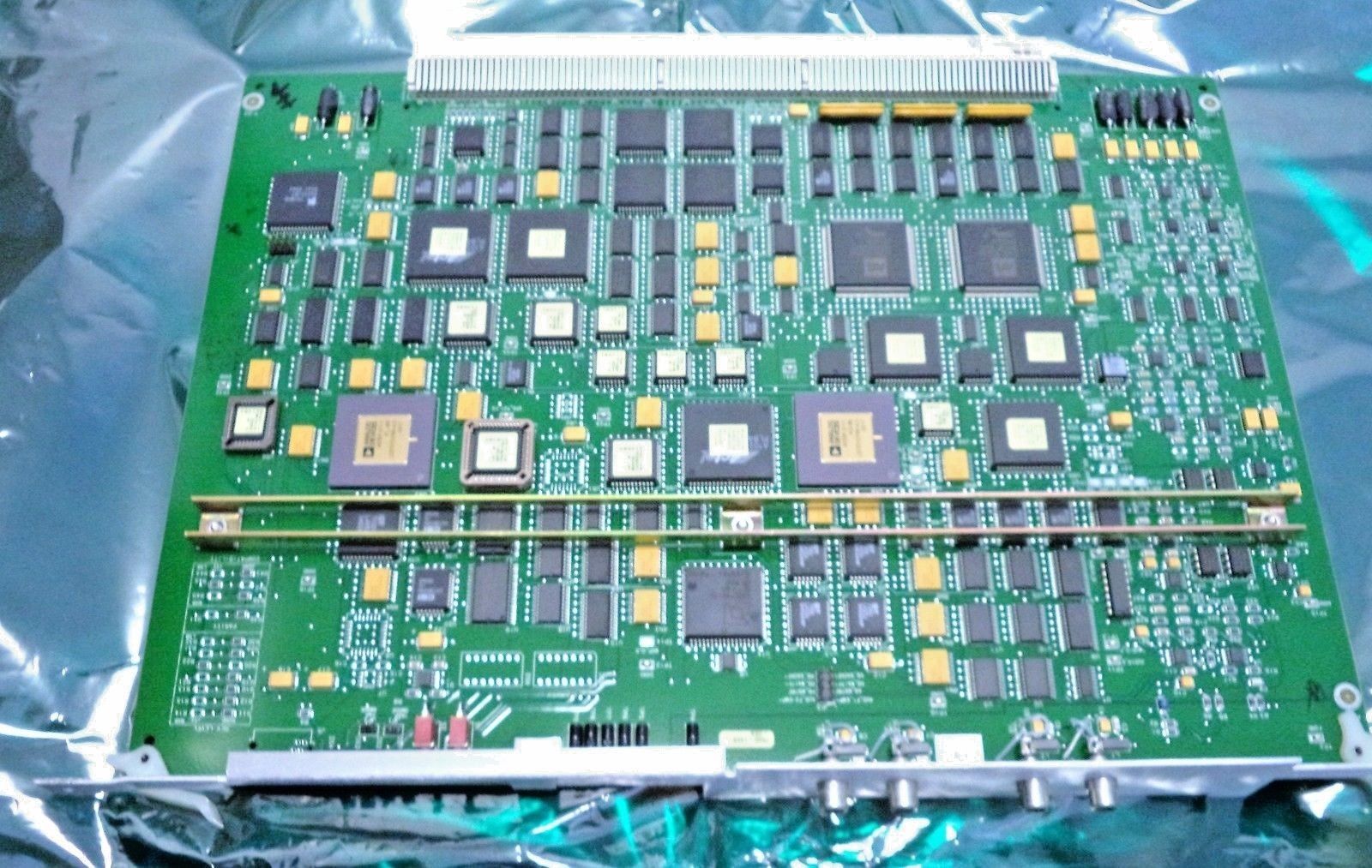 a close up of a computer board in a plastic bag