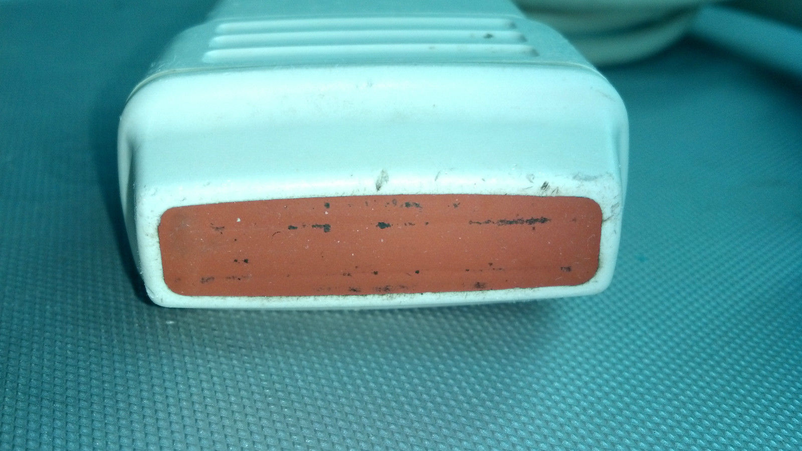 a close up of a white and red object on a table