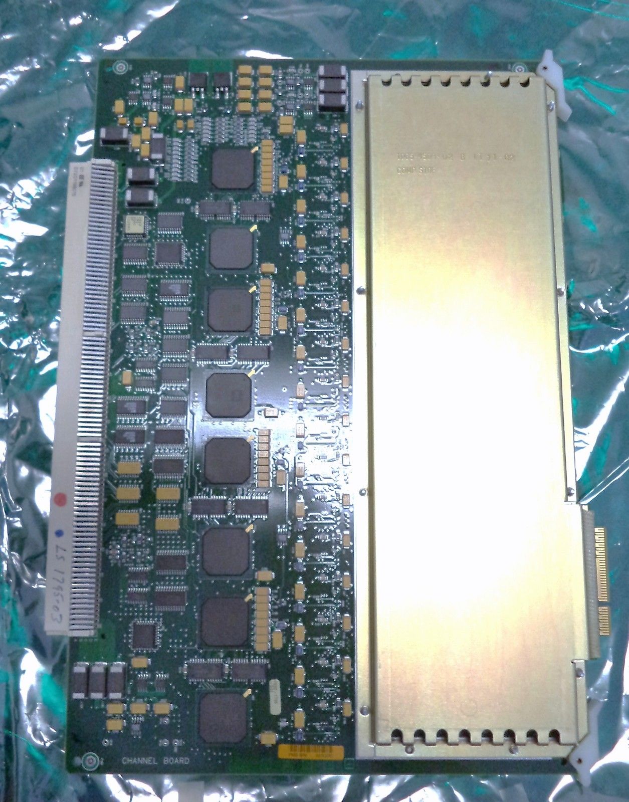 a close up of a computer board on a plastic bag